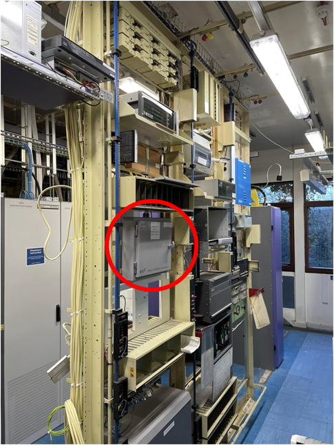 MEIK cabinet installed in an exchange equipment rack, circled in red