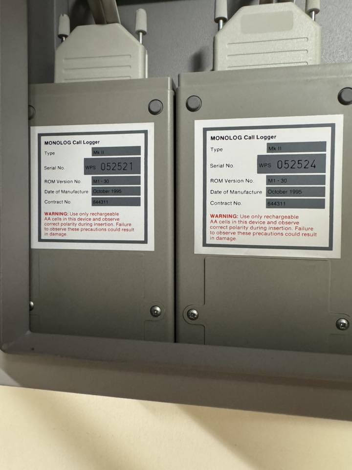 Monolog Mk II unit labels showing serial numbers, ROM version M1-30, October 1995